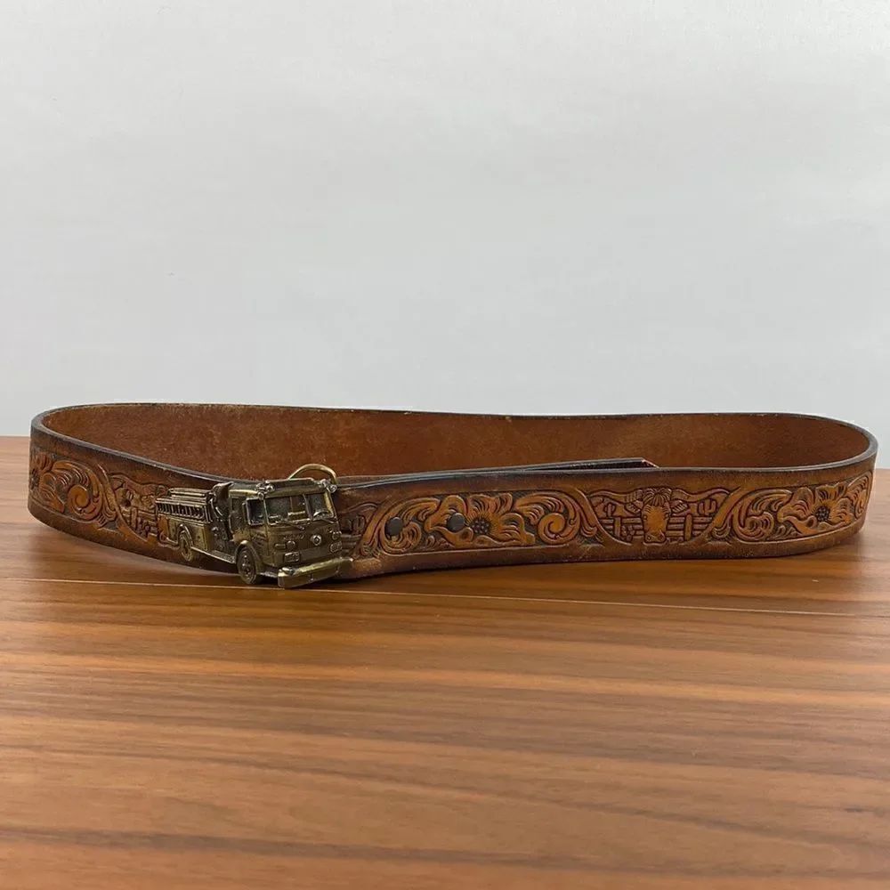 Vintage brown leather hand tooled Western belt.